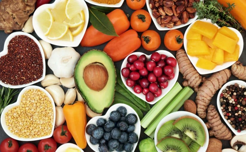 A picture of various antioxidant-rich foods, including avocado, lemon, peppers, berries, and more.